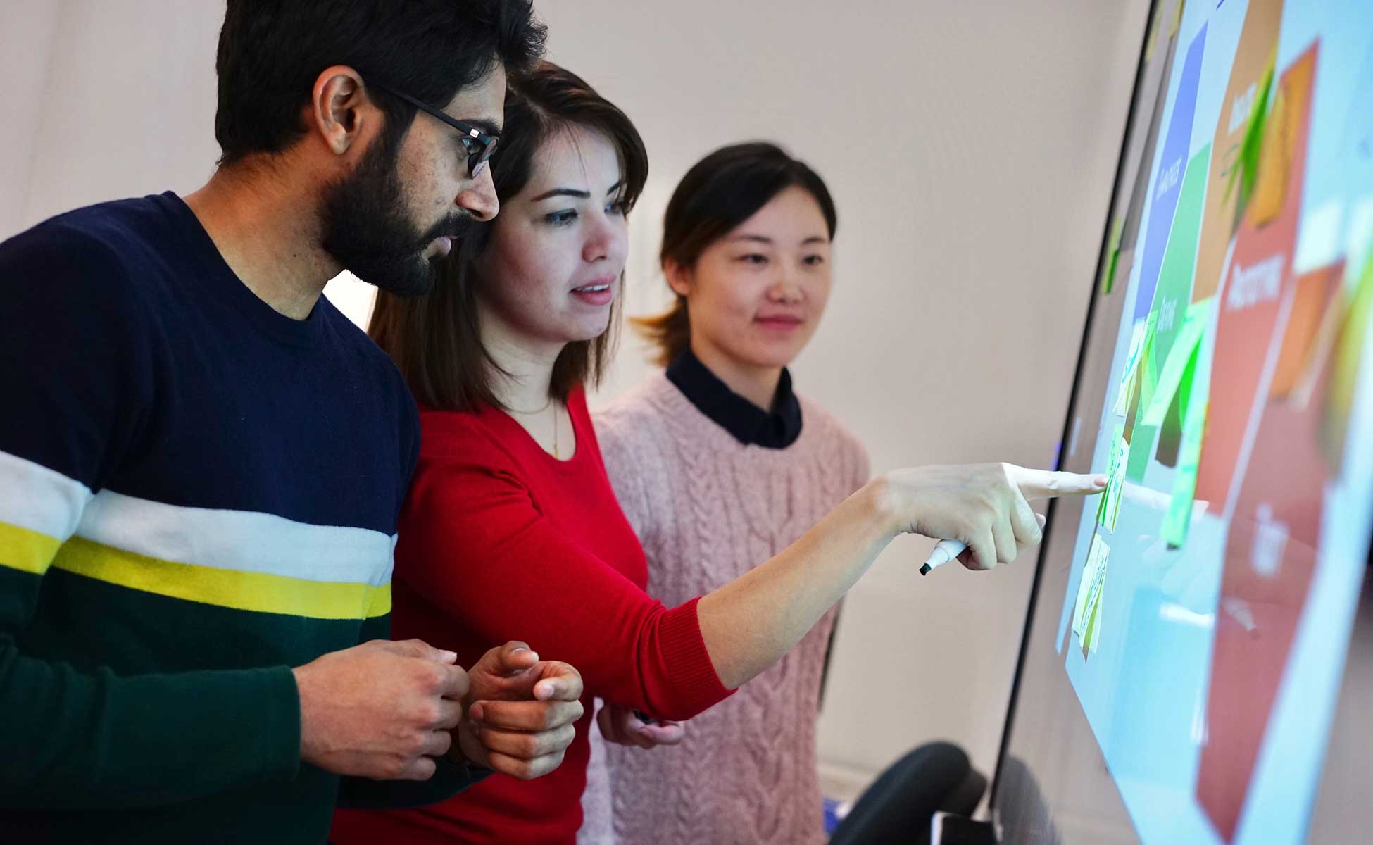 GST students using smart board in class