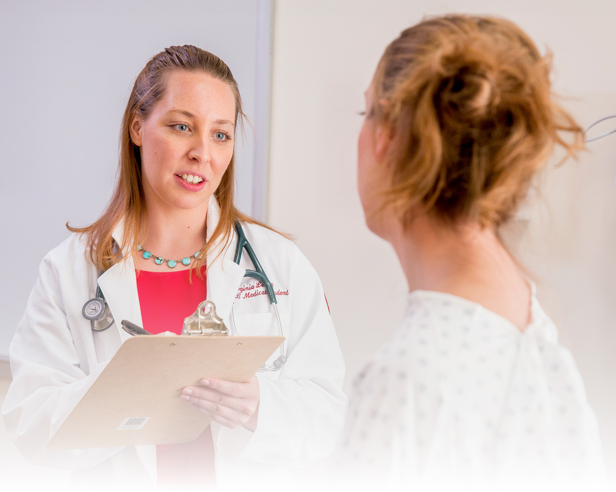 doctor speaking with patient