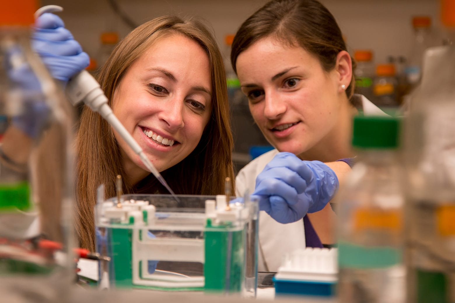 Two female NYMC researchers working in lab