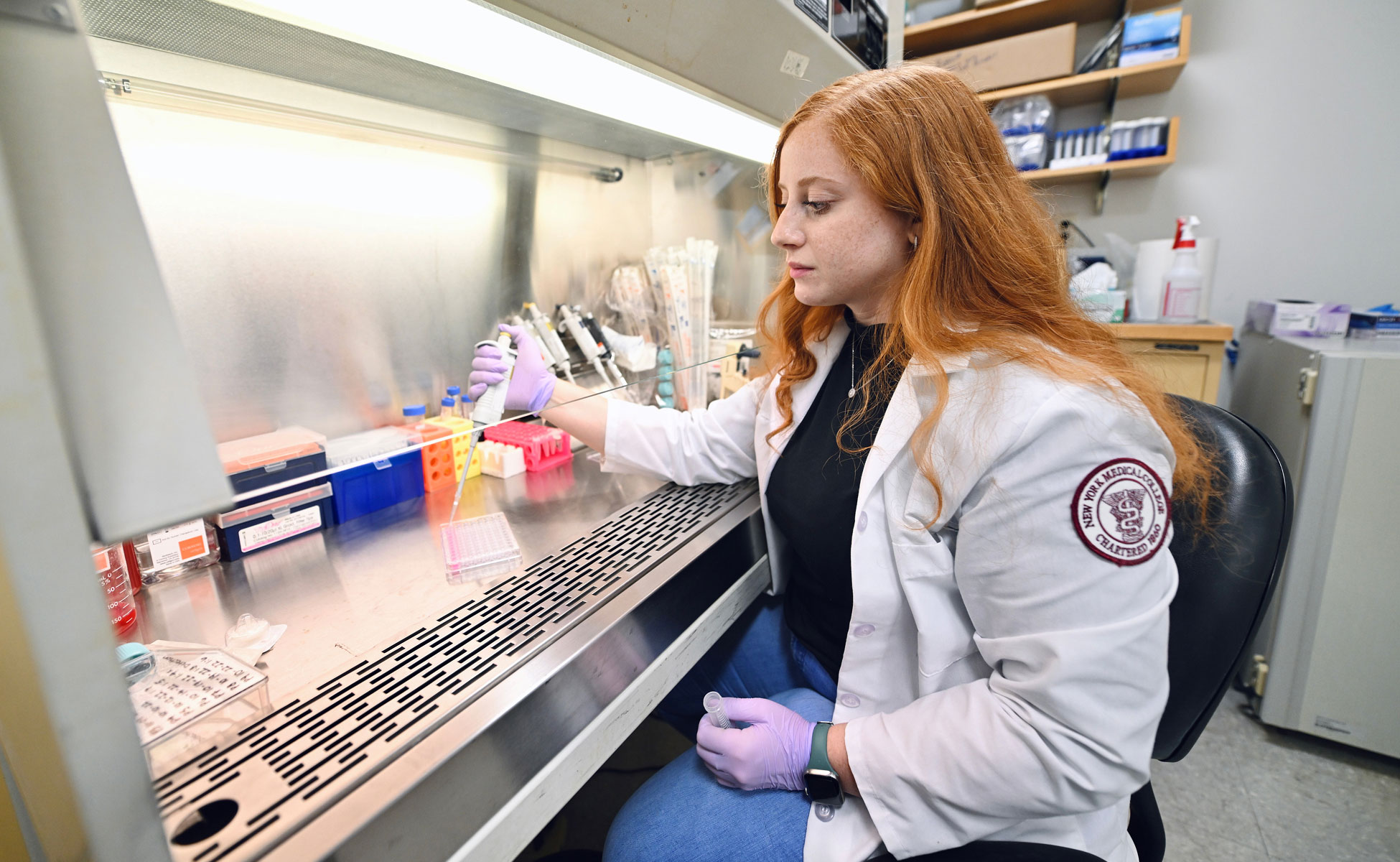 Female student working with liquids in lab