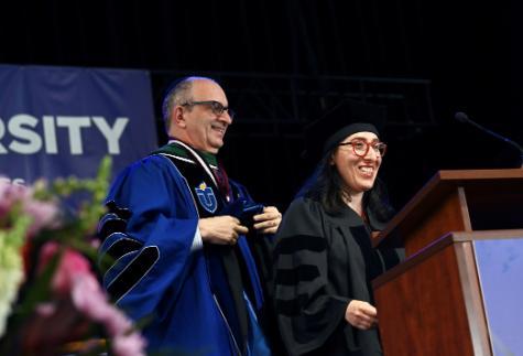 Touro University President Dr. Alan Kadish hooding Rivka Schiller, Ph.D., first doctoral graduate in Jewish Studies 