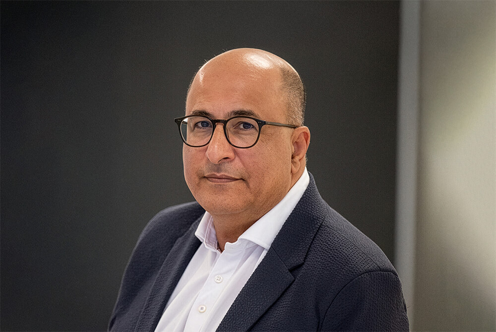 Ambassador Ido Aharoni Aronoff, a man with glasses in a dark jacket and white shirt