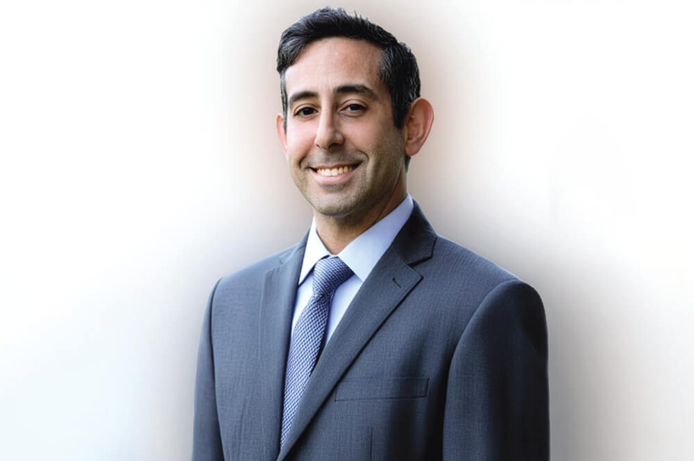 Mark Goldfeder, man in a blue suit and tie