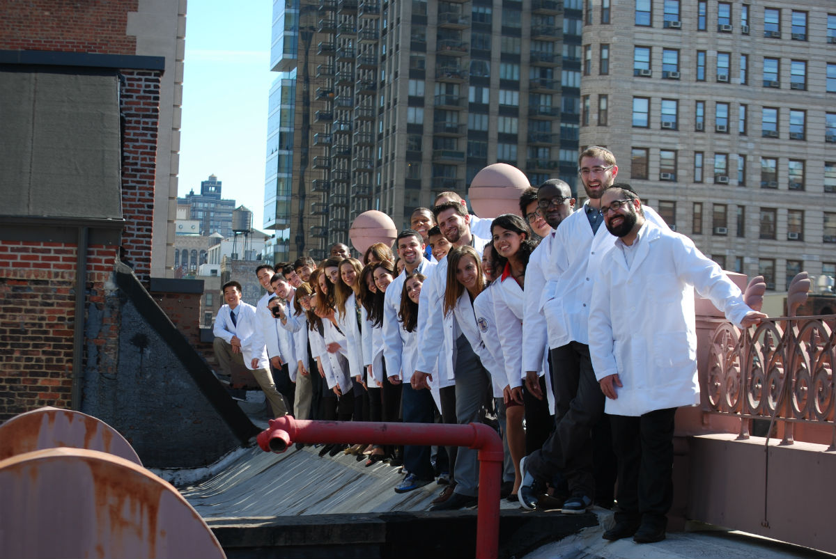 After the ceremony, students gathered for class photos on the rooftop of the College with the New York City skyline in the backdrop. 