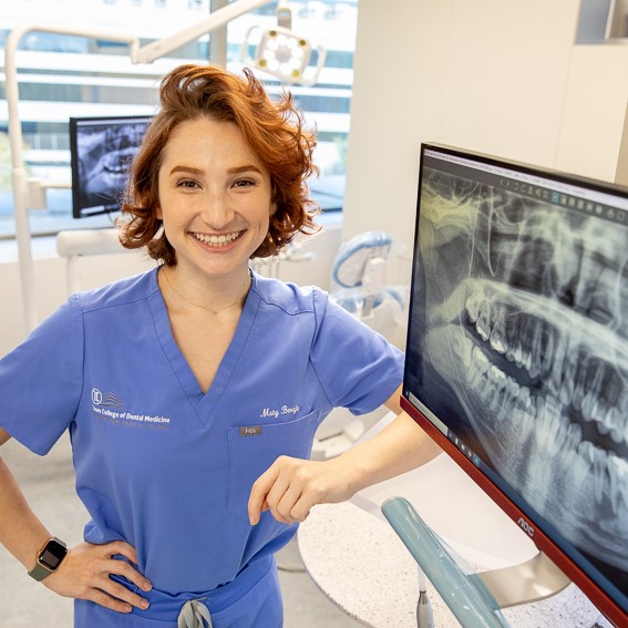 Matilde Beraja next to mouth xrays