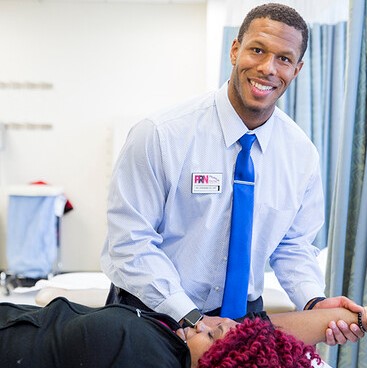 physical therapist working with patient