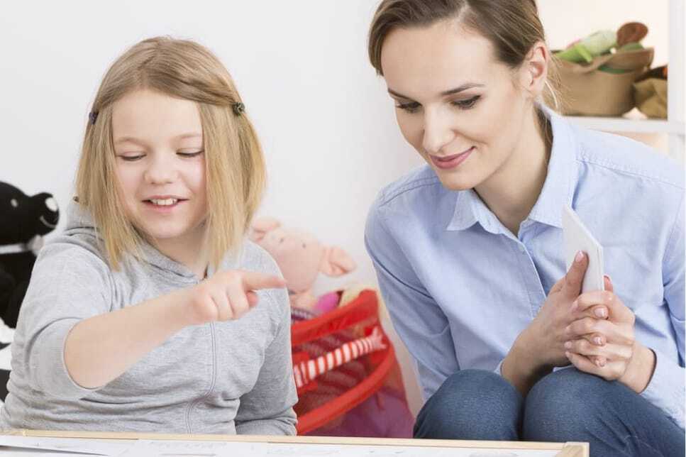 therapist helping child