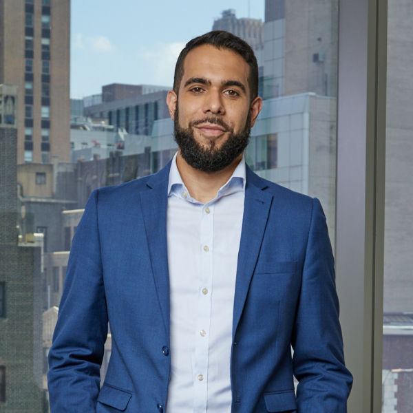 Dov Gottlieb, Esq. standing in front of windows