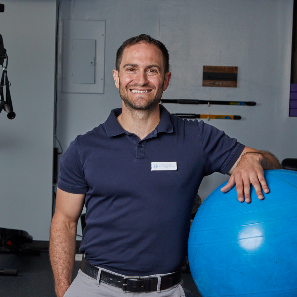 physical therapist with exercise ball