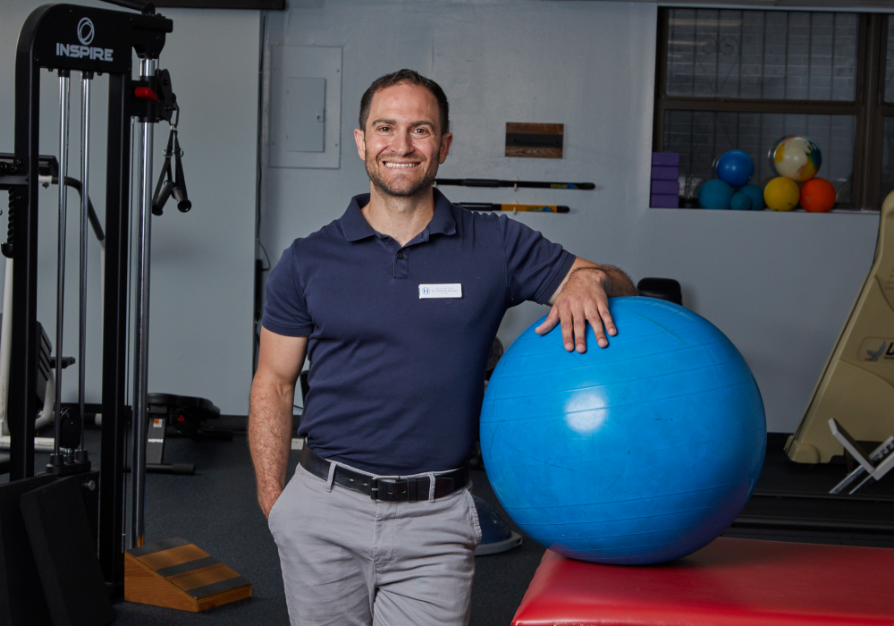 Yehuda Daniel in workout area with exercise ball